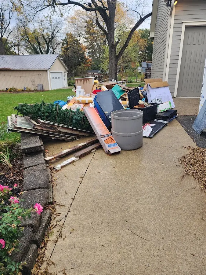 Dumpster being loaded with debris for 3 Yard Dumpster Rental in North Palm Beach